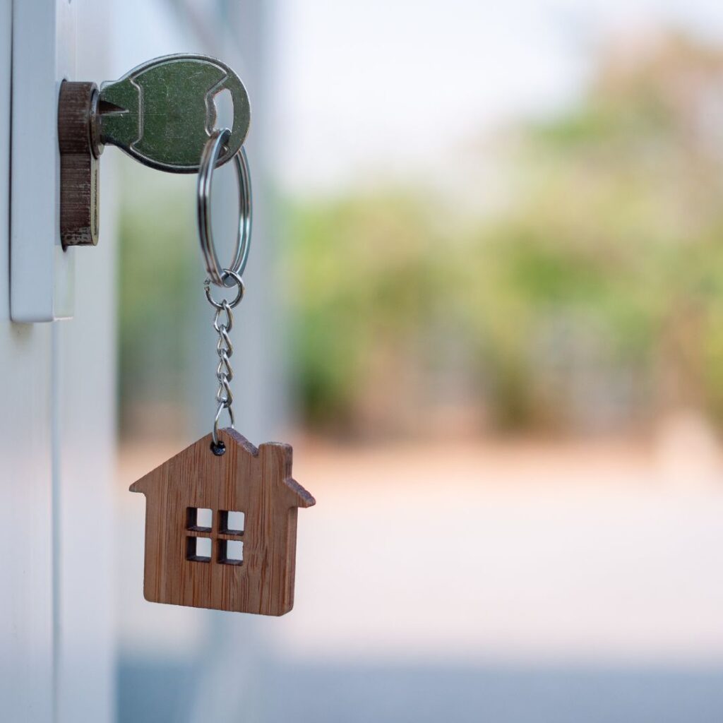 House keychain and key at front door